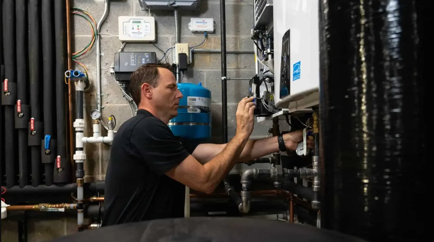 A Blue Planet technician servicing a water heater